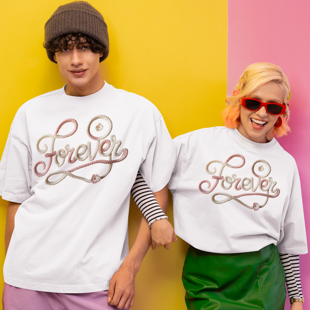 Two people wearing white t-shirts with 'Forever' text on a colorful background