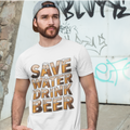 Man wearing a white t-shirt with 'Save Water Drink Beer' text against a graffiti-covered wall.